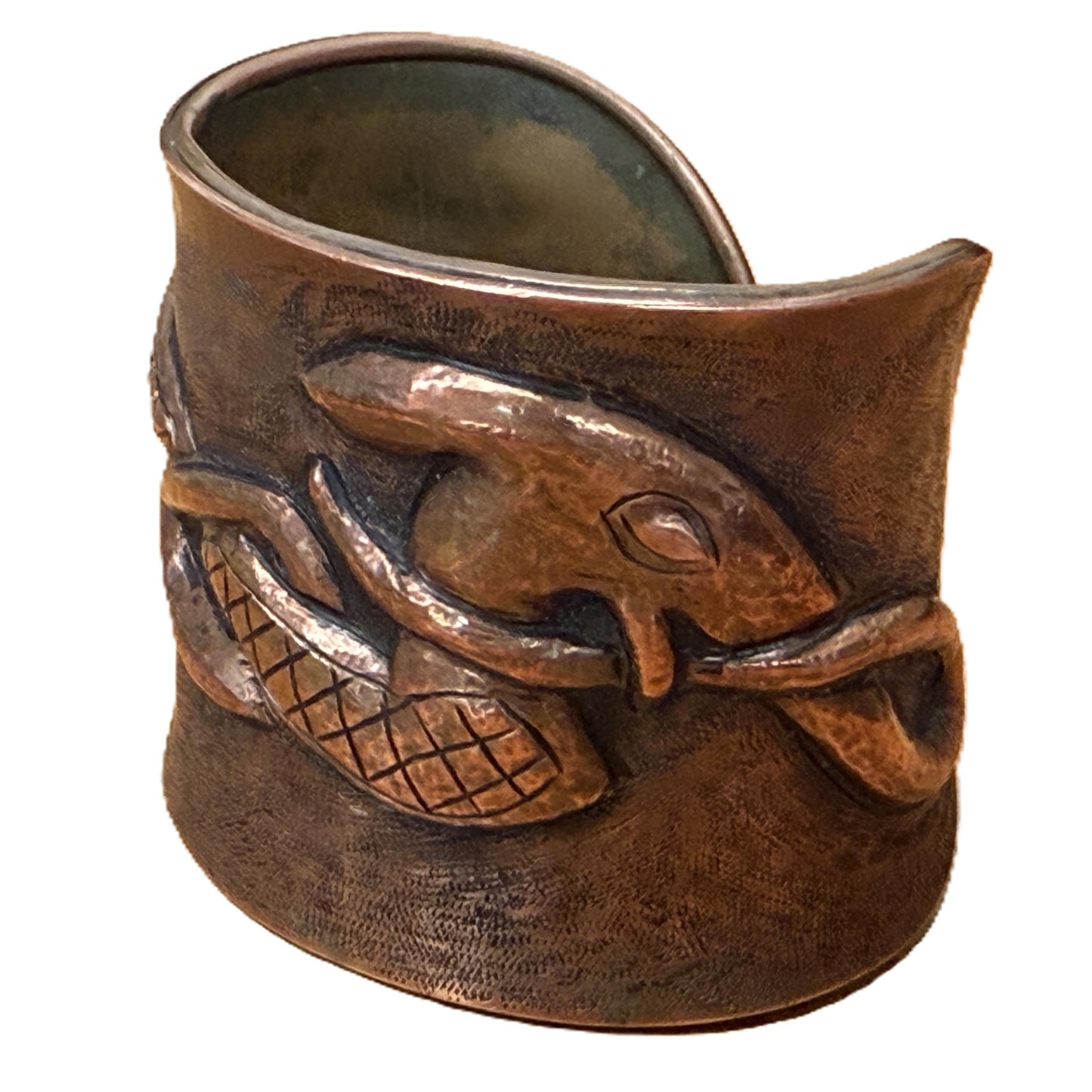 Bronze cuff bracelet with dragon design on a white background