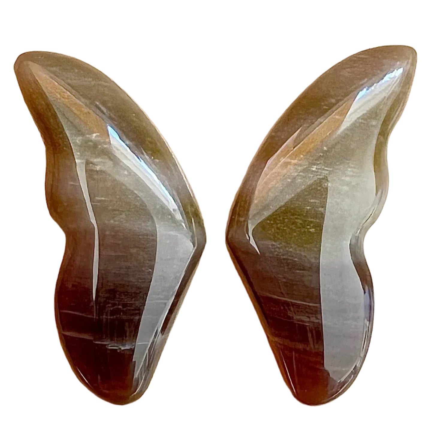 Two brown and white stone carvings on a white background